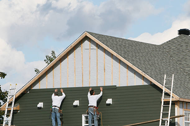 Professional Siding Contractor technician working in Jericho, NY